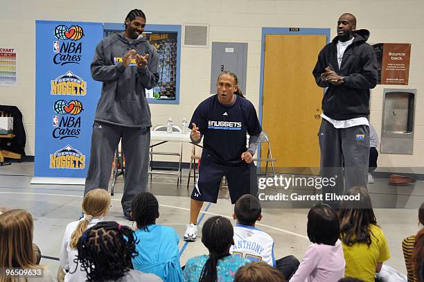 Nene, Strength and Conditioning Coach Steve Hess and Johan Petro of the Denver Nuggets visit with students at Palmer Elementary as part of the Denver...