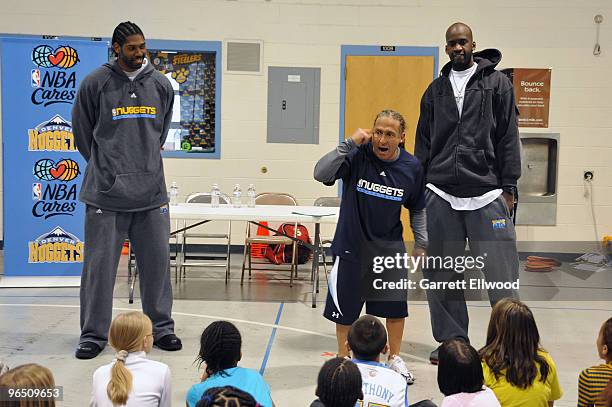 Nene, Strength and Conditioning Coach Steve Hess and Johan Petro of the Denver Nuggets visit with students at Palmer Elementary as part of the Denver...