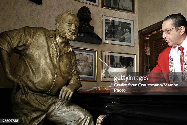 Life-size bronze statue of American writer Ernest "Papa" Hemingway, Literature Nobel Prize winner, leans on the bar at his regular spot at the...