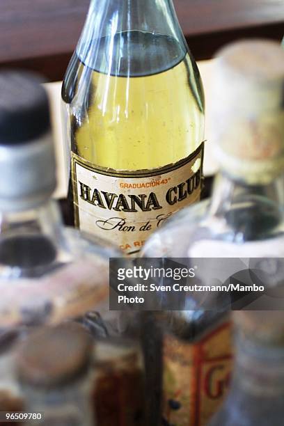 Bottle of Havana Club rum and and other alcoholic beverages stand on a table in the living room of the Ernest Hemingway house at the Finca Vigia, on...