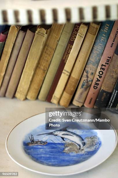 Plate with the painting of a Blue Marlin swordfish lies on a book-shelf of the Ernest Hemingway house at the Finca Vigia, on November 11, 2002 in...