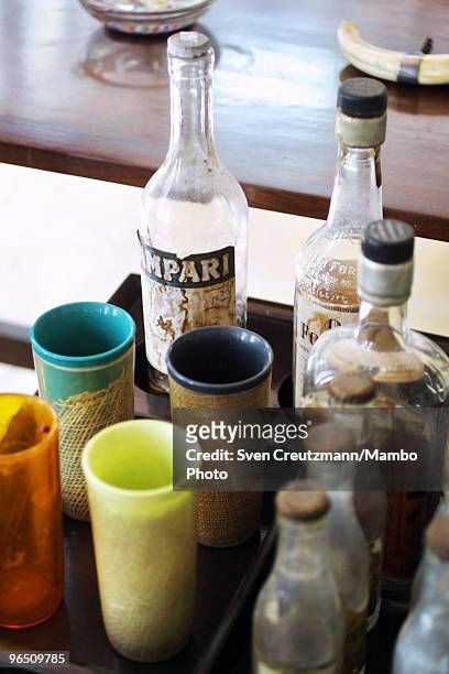 Campari bottle and other alcoholic beverages stand on a table in the living room of the Ernest Hemingway house at the Finca Vigia, on November 11,...