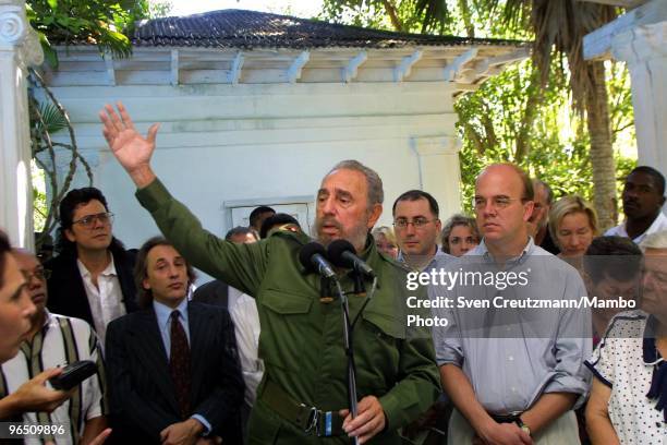 Fidel Castro , Cuba�s head of State and Party, gives a speech as he stands next to US Congressman Jim McGovern after signing a treaty between Cuba...