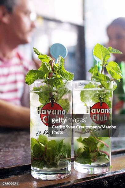 Two Mojito, a typical Cuban rum cocktail, stand at the bar of the Bodeguita del Medio bar and restaurant in Habana Vieja, Old Havana, on October 17...