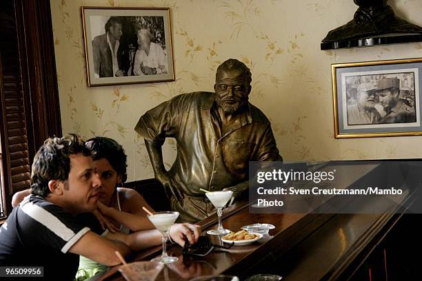 Life-size bronze statue of American writer Ernest "Papa" Hemingway, Literature Nobel Prize winner, leans on the bar at his regular spot at the Bar,...