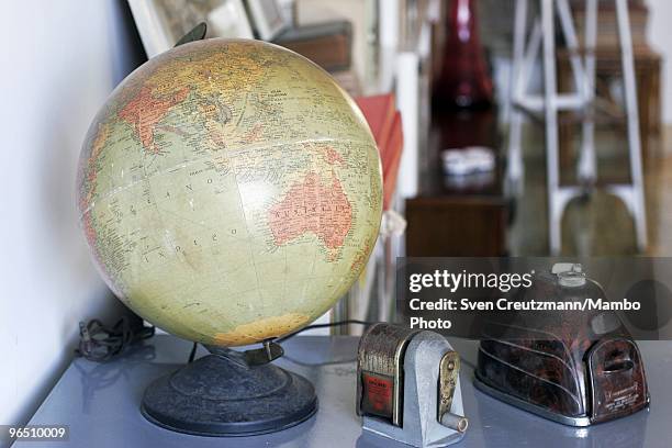 Globe and office utilities stand on a table in Ernest Hemingway�s house at the Finca Vigia, on January 6, 2007 in Havana, Cuba. The Hemingway Finca...