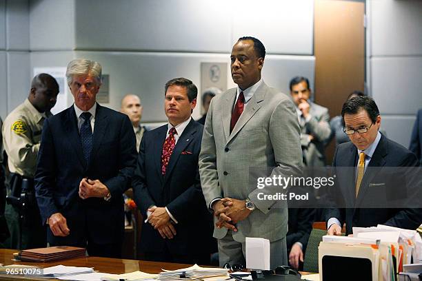 Dr. Conrad Murray , his attorney Ed Chernoff and defense team members stand before Los Angeles Superior Court Judge Keith L. Schwartz as Murray is...