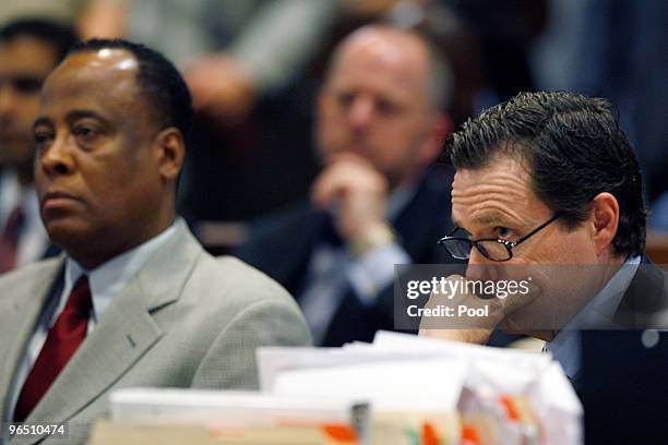 Dr. Conrad Murray and defense attorney Ed Chernoff listen to Los Angeles Superior Court Judge Keith L. Schwartz as Murray is arraigned in the County...