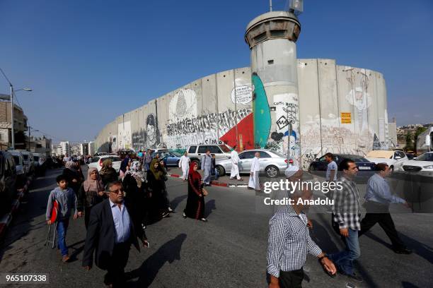 Palestinian worshippers, mostly from women wait pass through the checkpoint from Bethlehem into Jerusalem after Israeli authorities let the...