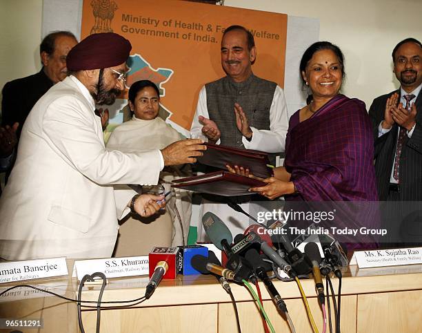 Minister of Health and Family Welfare secretary K. Sujatha Rao and Railway Board chairman S. S. Khurana exchange files in presence of Minister of...