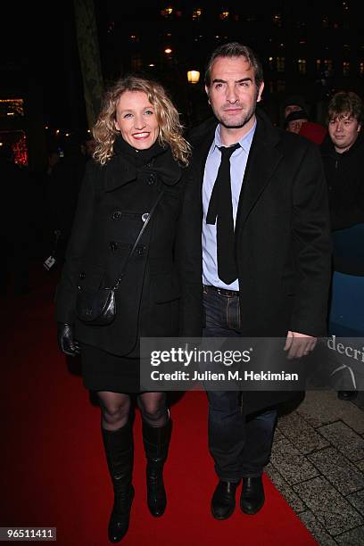 Jean Dujardin and Alexandra Lamy attend the Globe de Cristal ceremony at Le Lido on February 8, 2010 in Paris, France.