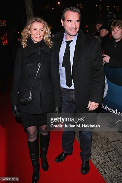 Jean Dujardin and Alexandra Lamy attend the Globe de Cristal ceremony at Le Lido on February 8, 2010 in Paris, France.