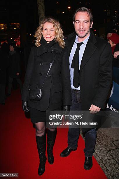 Jean Dujardin and Alexandra Lamy attend the Globe de Cristal ceremony at Le Lido on February 8, 2010 in Paris, France.