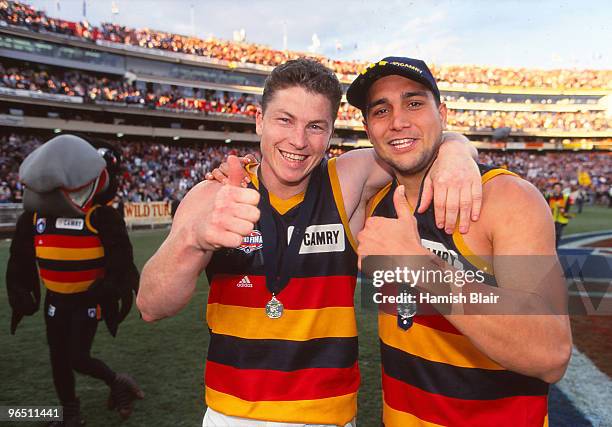 Mark Bickley of the Crows and team mate Andrew McLeod celebrate following the AFL Grand Final match between the Adelaide Crows and the St Kilda...