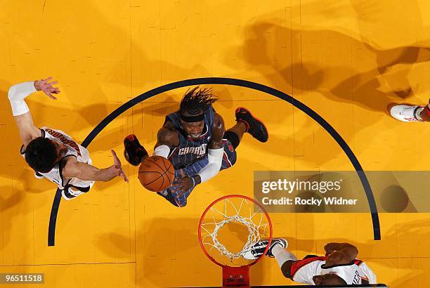 Gerald Wallace of the Charlotte Bobcats shoos a layup against Vladimir Radmanovic of the Golden State Warriors during the game at Oracle Arena on...