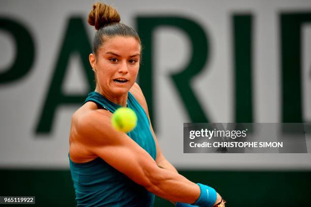 Greece's Maria Sakkari plays a backhand return to Russia's Daria Kasatkina during their women's singles third round match on day six of The Roland...