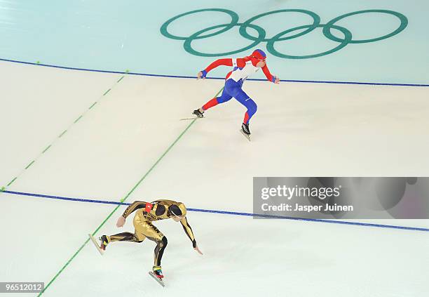 Yevgeny Lalenkov of Russia and Kato Joji of Japan practice during speedskating previews at the Richmond Olympic Oval ahead of the Vancouver 2010...