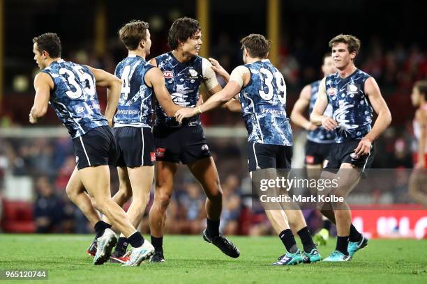 Jack Silvagni of the Blues celebrates with his team mates after kicking a goal during the round 11 AFL match between the Sydney Swans and the Carlton...