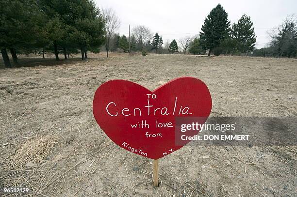 Message on a sign in the shape of a heart is found in a vacant lot February 2, 2010 in Centralia, PA. The lot, until two months ago, had the home of...