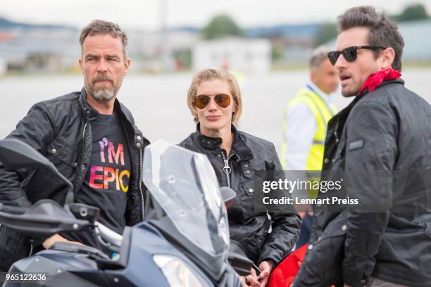 EpicRiders JR Bourne , Katee Sackhoff and Ian Bohen wait on the apron during the arrival of the Life Ball plane on June 1, 2018 in Salzburg, Austria....