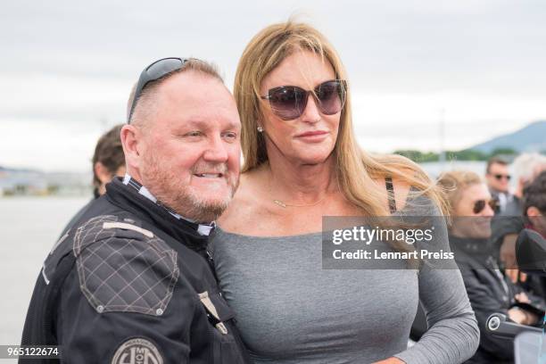 AmfAR CEO Kevin Robert Frost and Caitlyn Jenner pose during the arrival of the Life Ball plane on June 1, 2018 in Salzburg, Austria. The EpicRiders...