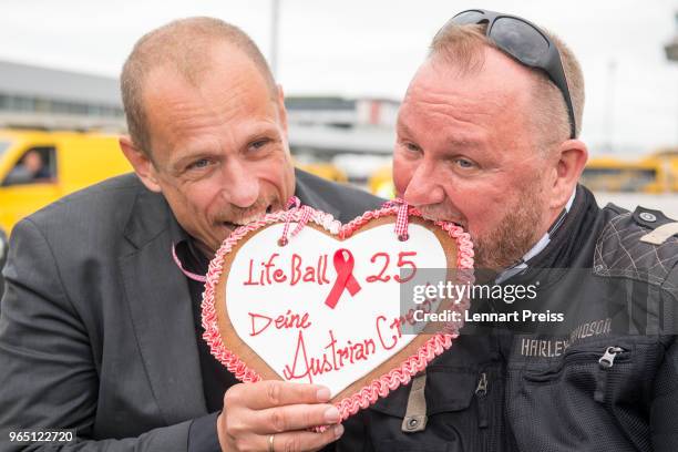 Life Ball organizer Gerald 'Gery' Keszler and amfAR CEO Kevin Robert Frost pose during the arrival of the Life Ball plane on June 1, 2018 in...