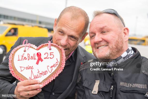 Life Ball organizer Gerald 'Gery' Keszler and amfAR CEO Kevin Robert Frost pose during the arrival of the Life Ball plane on June 1, 2018 in...