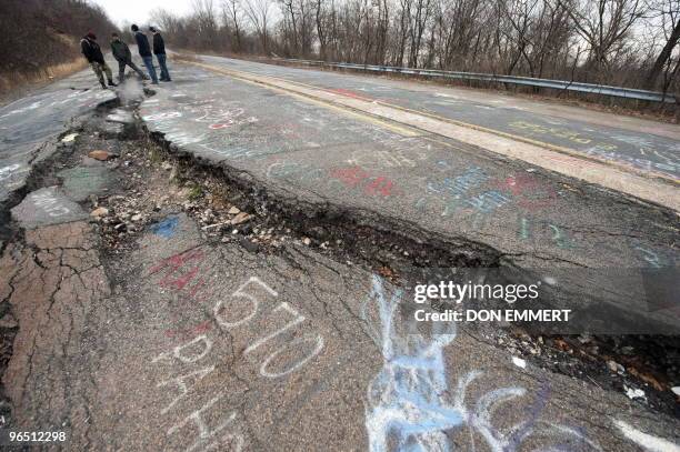 Group of young men from Philadelphia explore a large crack in PA Highway 61, caused by the underground coal fire, February 2, 2010 in Centralia, PA....