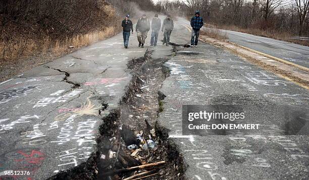 Group of young men from Philadelphia explore a large crack in PA Highway 61, caused by the underground coal fire, February 2, 2010 in Centralia, PA....