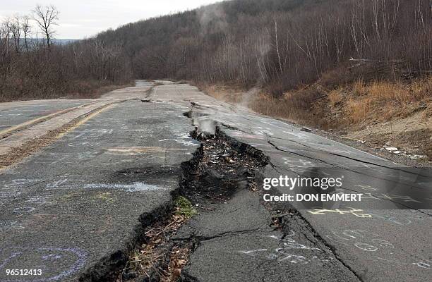 Smoke rises from a large crack in PA Highway 61, caused by the underground coal fire, February 2, 2010 in Centralia, PA. The highway, now closed,...