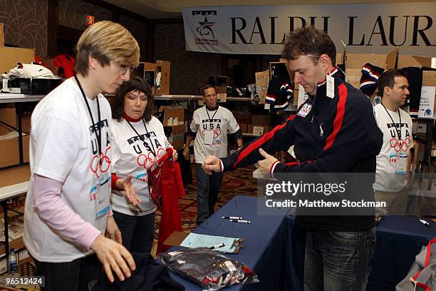 Tony Benshoof receives the official Polo Ralph Lauren teamwear during the Team USA processing at the Delta Hotel ahead of the Vancouver 2010 Winter...