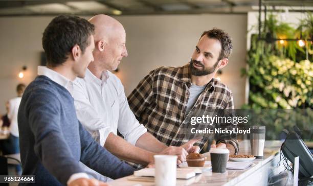 three men meeting to discuss business - smart casual lunch stock pictures, royalty-free photos & images