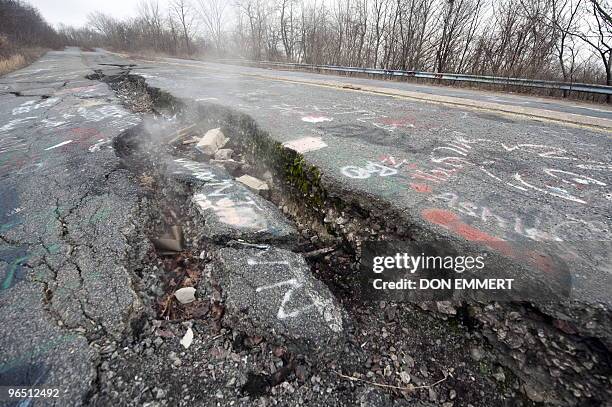 Smoke rises from a large crack in PA Highway 61, caused by the underground coal fire, February 2, 2010 in Centralia, PA. The highway, now closed,...