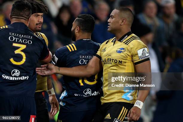 An altercation breaks out between players during the round 16 Super Rugby match between the Highlanders and the Hurricanes at Forsyth Barr Stadium on...