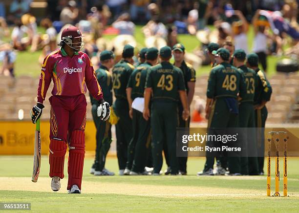 Chris Gayle of the West Indies walks from the ground after being dismissed by the first ball of the match by Doug Bollinger of Australia during the...