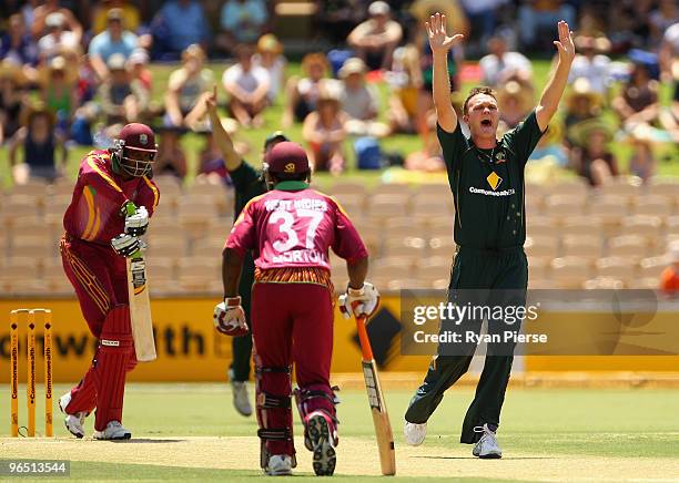 Doug Bollinger of Australia celebrates after dismissing Chris Gayle of the West Indies with the first ball of the match during the second One Day...