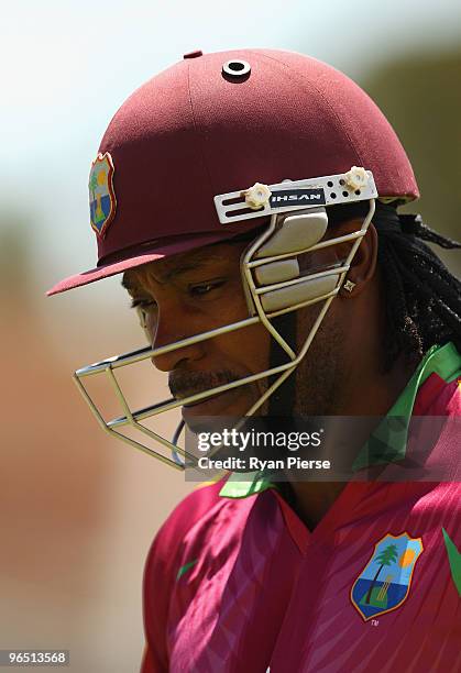 Chris Gayle of the West Indies walks from the ground after being dismissed by the first ball of the match by Doug Bollinger of Australia during the...