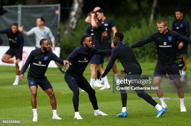 Raheem Sterling, Nathaniel Chalobah and Eric Dier take part during the England training session at The Grove Hotel on June 1, 2018 in Hertford,...