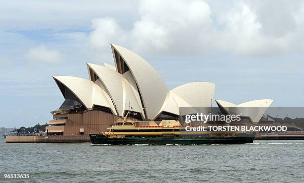 The commuter ferry 'Freshwater' departs Circular Quay past the white-tiled sails of the Sydney Opera House on February 8, 2010. The iconic Australian...