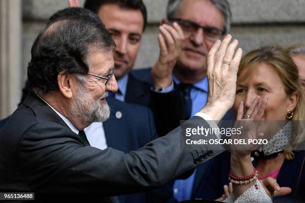 Spanish out-going Prime Minister Mariano Rajoy leaves after a vote on a no-confidence motion at the Lower House of the Spanish Parliament in Madrid...