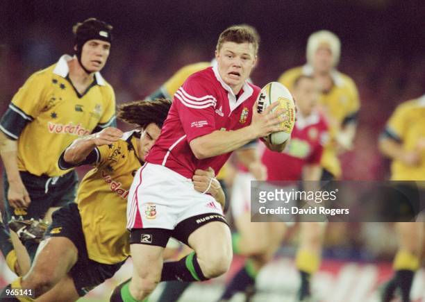 Brian O''Driscoll of the British Lions takes on the Australia defence during the British and Irish Lions tour match against Australia played at the...