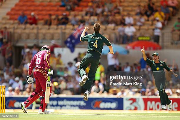 Doug Bollinger of Australia celebrates taking the wicket of Chris Gayle of the West Indies off the first ball of the match during the second One Day...