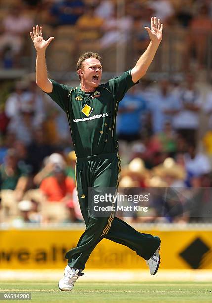 Doug Bollinger of Australia celebrates taking the wicket of Runako Morton of the West Indies during the second One Day International between...