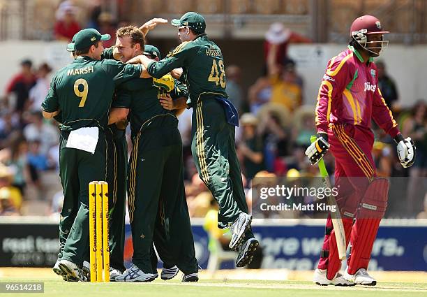 Doug Bollinger of Australia celebrates taking the wicket of Chris Gayle of the West Indies off the first ball of the match during the second One Day...