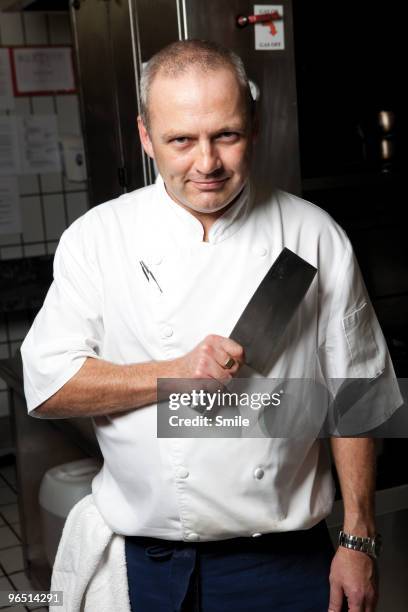 portrait of chef with meat cleaver - cleaver stock pictures, royalty-free photos & images