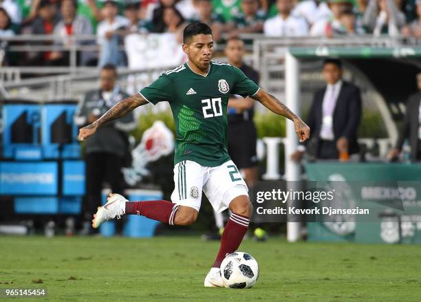 Javier Aquino of Mexico i action against Wales during the second half of their friendly international soccer at the Rose Bowl on May 28, 2018 in...