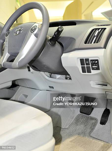Picture shows the interior of a Toyota Prius hybrid vehicle including brake and accelerator pedals at the company's showroom in Tokyo on February 9,...