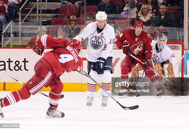 Zbynek Michalek of the Phoenix Coyotes fires a shot past Ethan Moreau of the Edmonton Oilers on Jeff Deslauriers on February 8, 2010 at Jobing.com...