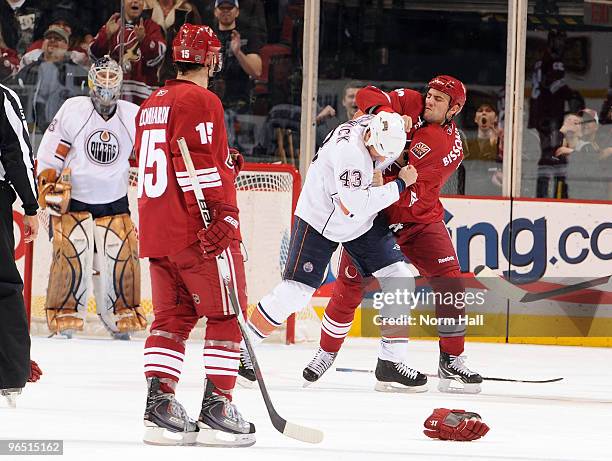 Paul Bissonnette of the Phoenix Coyotes and Jason Strudwick of the Edmonton Oilers mix it up on February 8, 2010 at Jobing.com Arena in Glendale,...