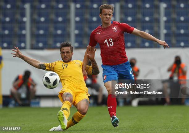 Josh Risdon of Australia is challenged by Jan Kopic of the Czech Republic during the International Friendly match between the Czech Republic and...